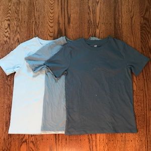 Three H&M t-shirts. Light, med and dark blue. 8-10